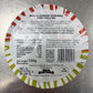 Round label with text and nutritional information on a metallic surface