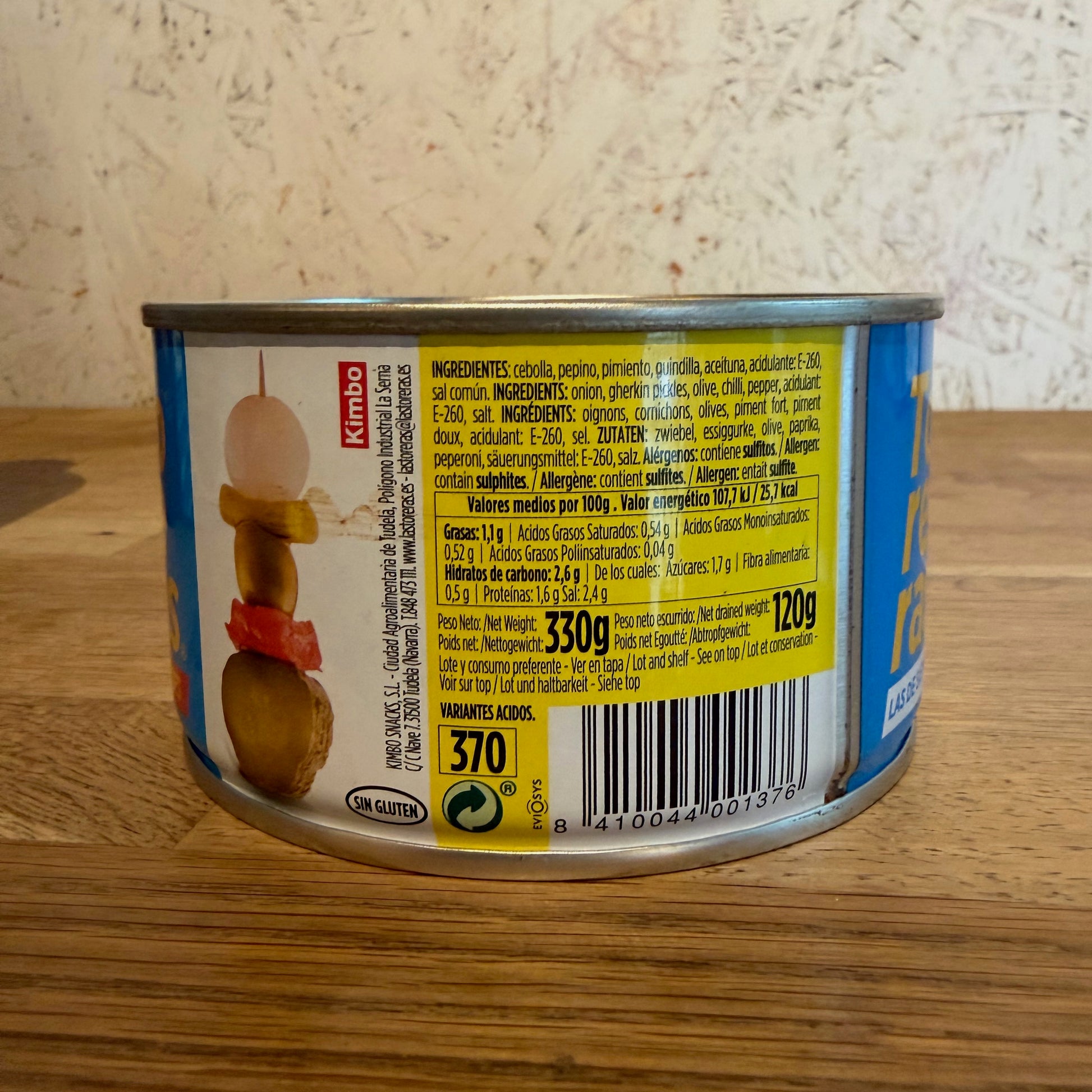 Can with label on a wooden surface